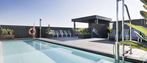 Outdoor pool, open 9:00 AM to 9:00 PM, pool loungers