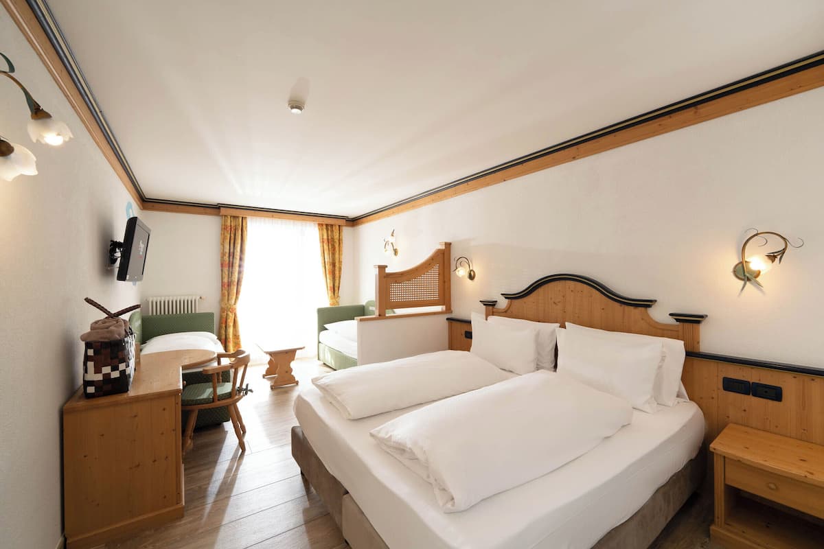 Family Quadruple Room | 1 bedroom, down comforters, pillowtop beds, in-room safe