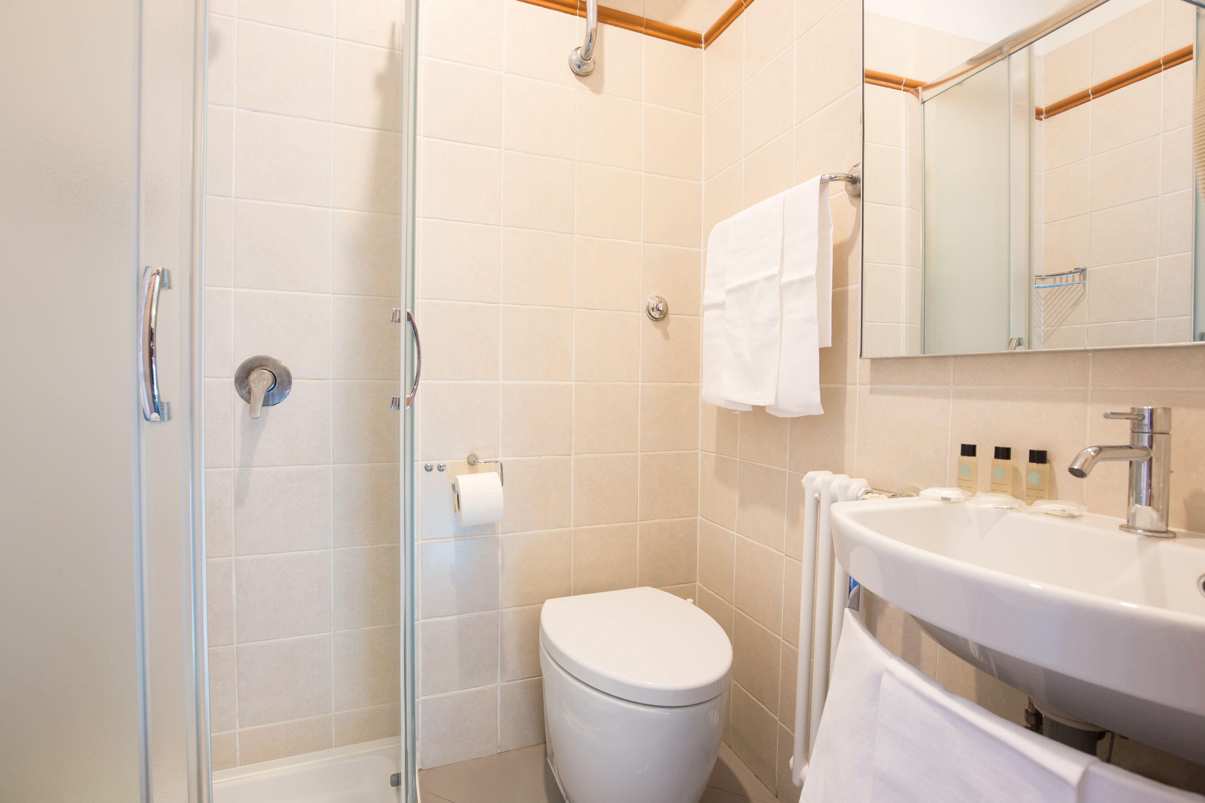 superior triple room | bathroom | shower, rainfall showerhead, free toiletries, hair dryer