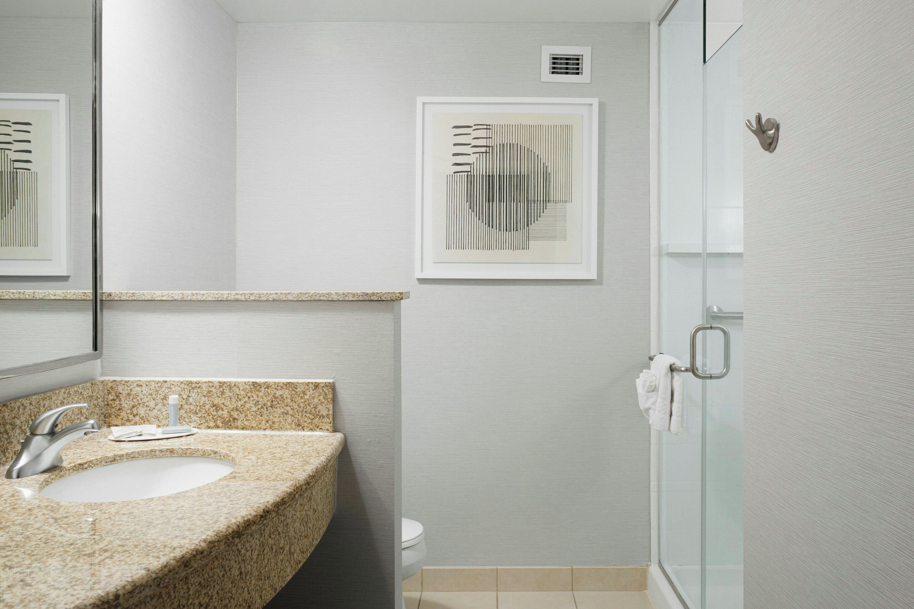 room, 1 king bed with sofa bed | bathroom | free toiletries, hair dryer, towels