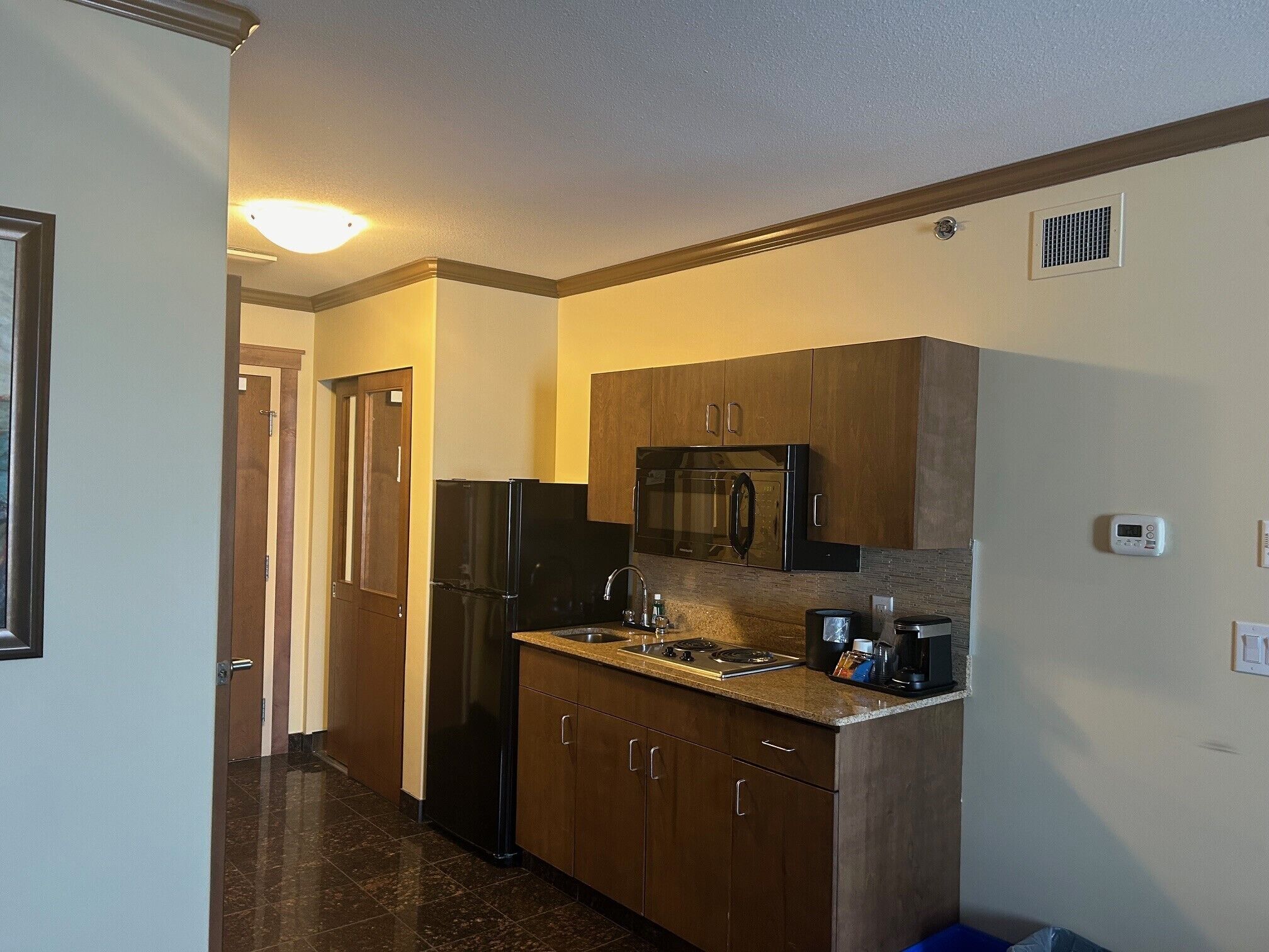 suite, 1 king bed with sofa bed, non smoking | private kitchenette | coffee/tea maker