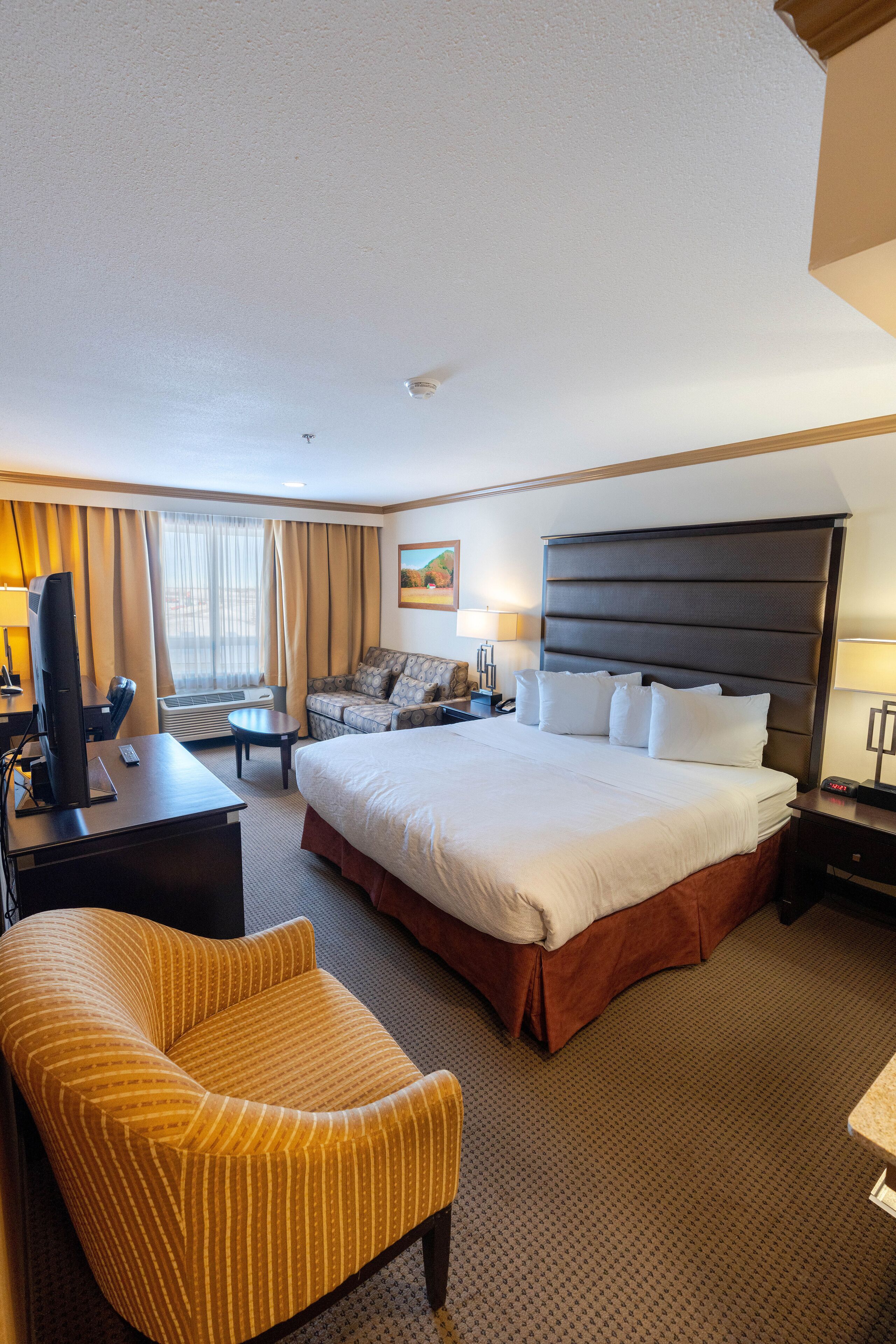 family suite, multiple beds, non smoking | in-room safe, desk, laptop workspace, iron/ironing board