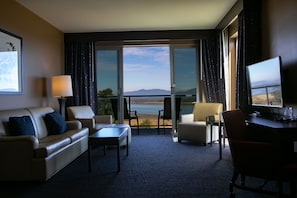 Suite, 1 King Bed, Bay View | Living room | 42-inch LCD TV with cable channels, TV, iPod dock