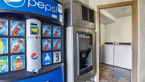 A vending machine with a Pepsi logo and various drink options, including water and soda.
