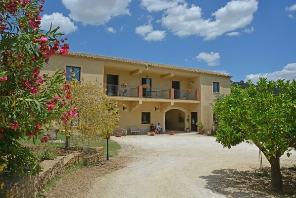 Guests can enjoy a balcony and a beautiful garden view from this two-story residence.