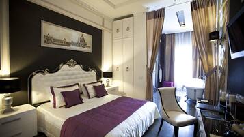 Premium bedding, free minibar items, in-room safe, desk