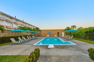 Outdoor pool, open 8:00 AM to 8:00 PM, pool umbrellas, sun loungers