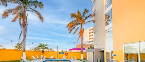 Outdoor pool, open 9:00 AM to 8:00 PM, sun loungers