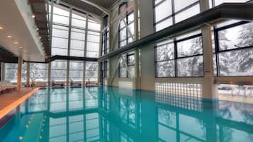 Indoor pool, open 10:00 AM to 10:00 PM, pool loungers