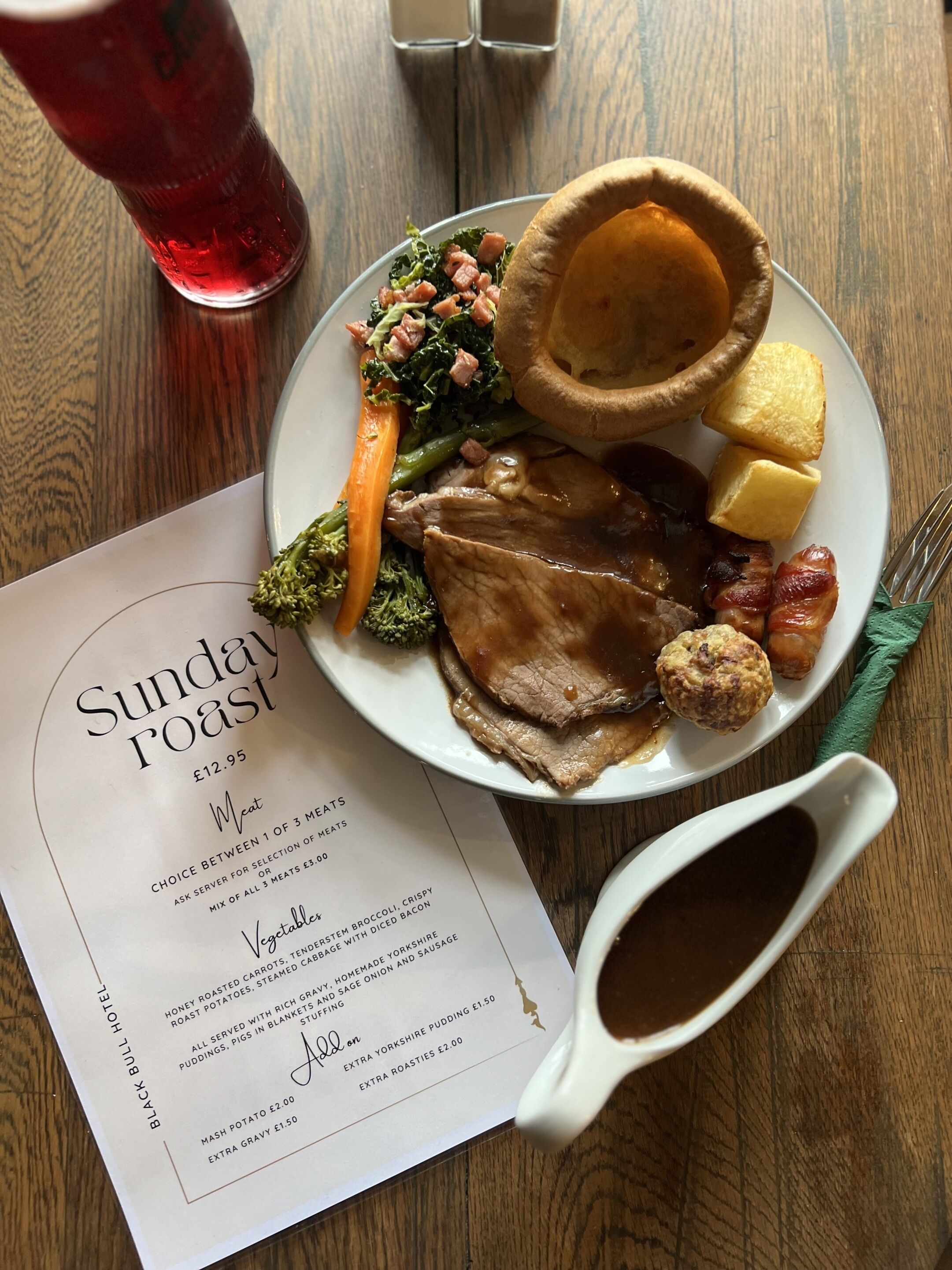 A Sunday Roast meal with a menu listing prices and options.