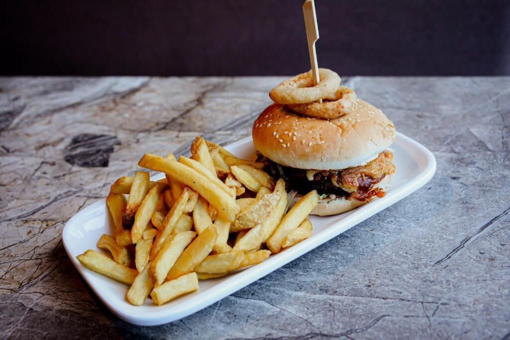 A plate with a burger and fries.