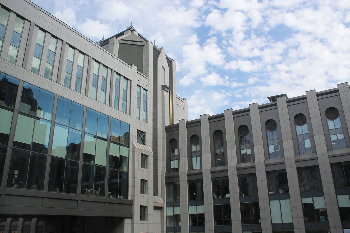 A modern building with large windows and a flat roof.