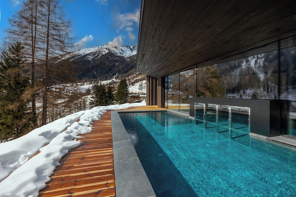 Indoor pool, outdoor pool, pool umbrellas, pool loungers