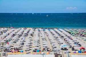 On the beach, sun loungers, beach umbrellas