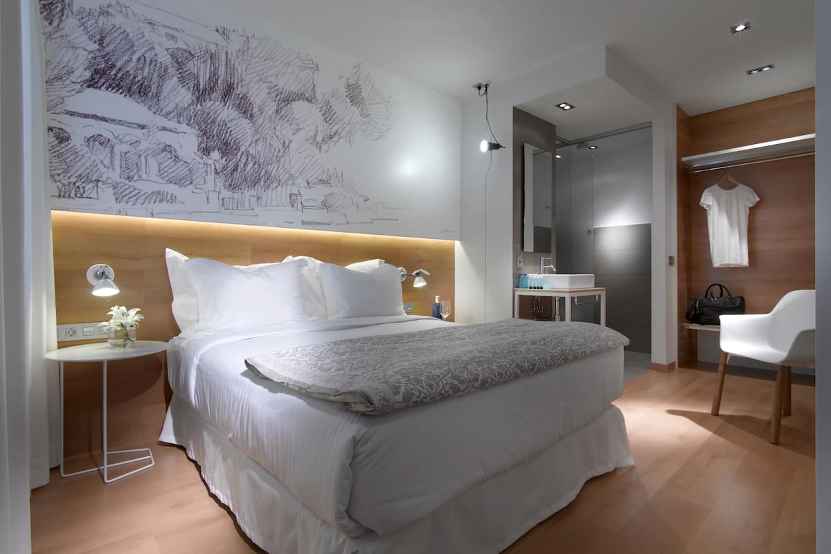 Premium bedding, down duvets, desk, laptop workspace