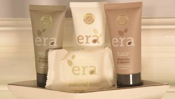 Three bottles of era hair shampoo and one bottle of era natural soap.