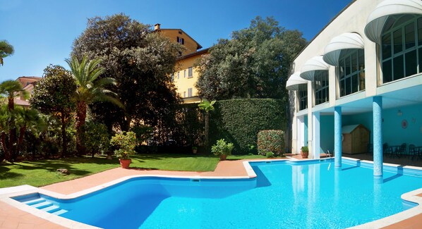 Seasonal outdoor pool, open 10:00 AM to 6:00 PM, pool umbrellas