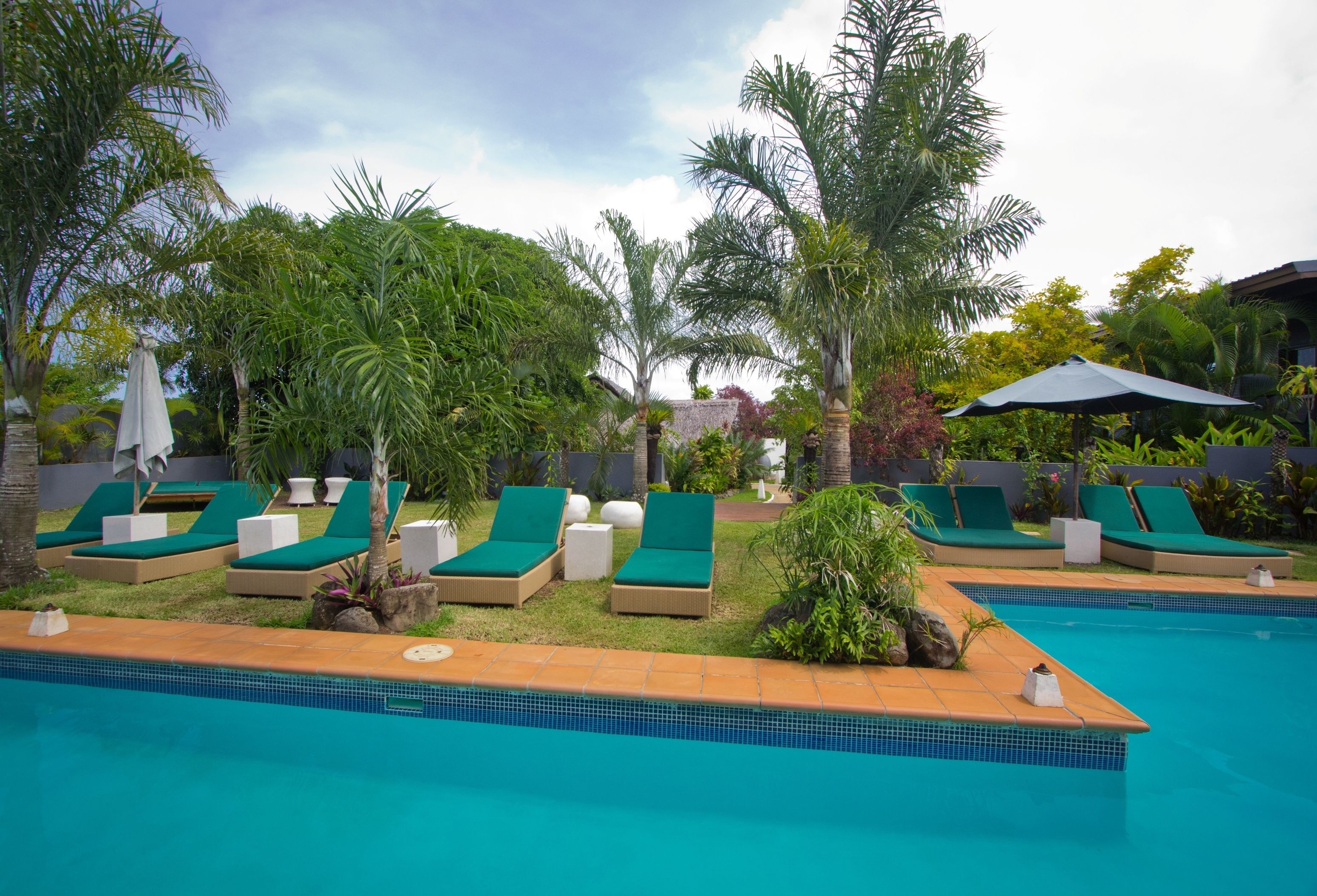 outdoor pool, pool umbrellas, pool loungers