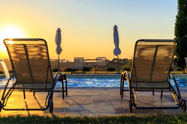 Seasonal outdoor pool, pool umbrellas, pool loungers