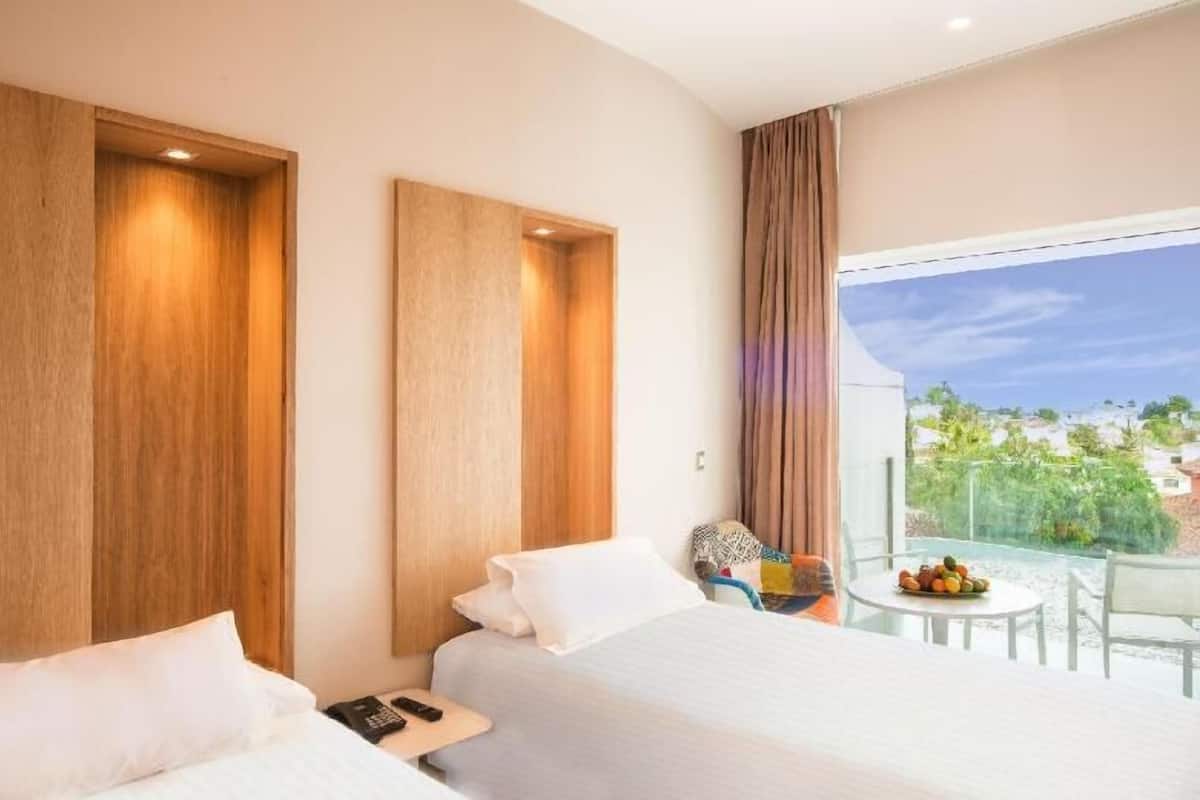 Ropa de cama de alta calidad y minibar