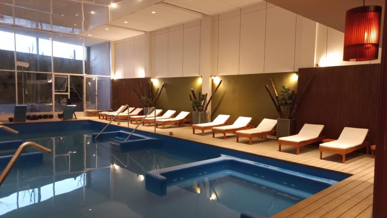 Indoor pool, outdoor pool, pool umbrellas