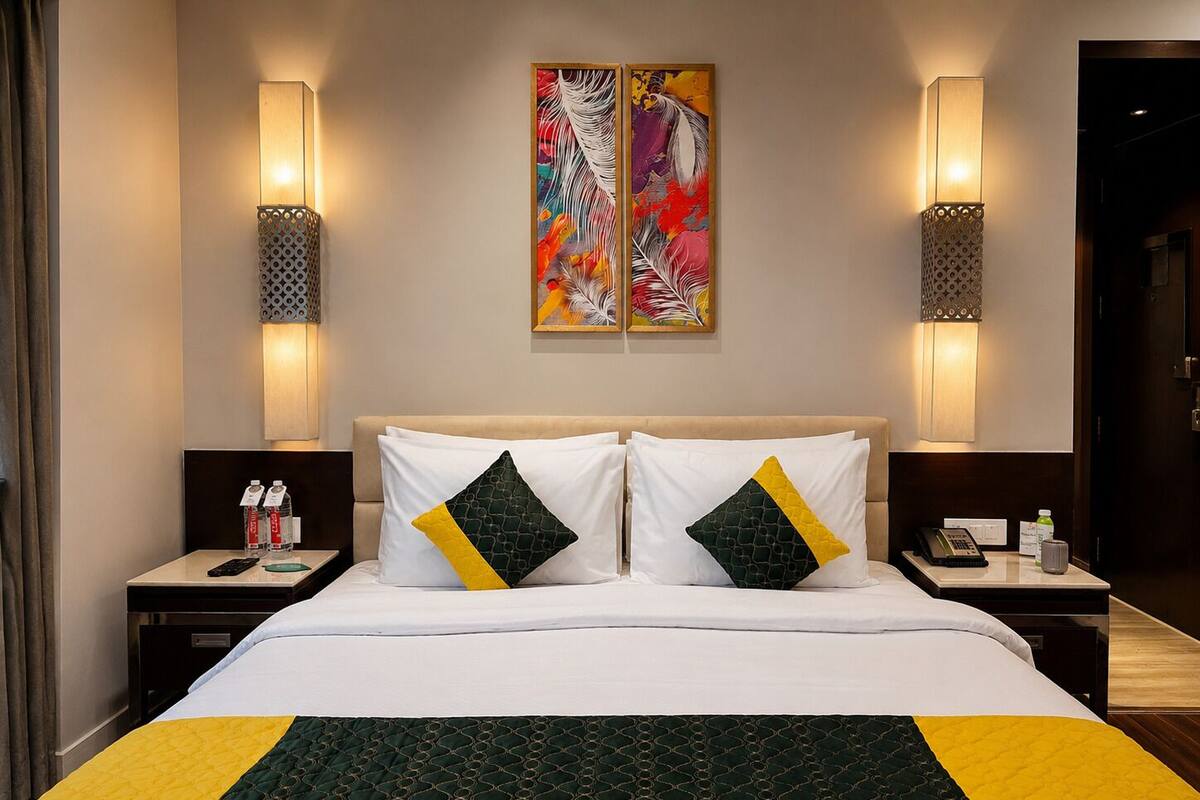 Habitación ejecutiva | Ropa de cama de alta calidad y minibar 