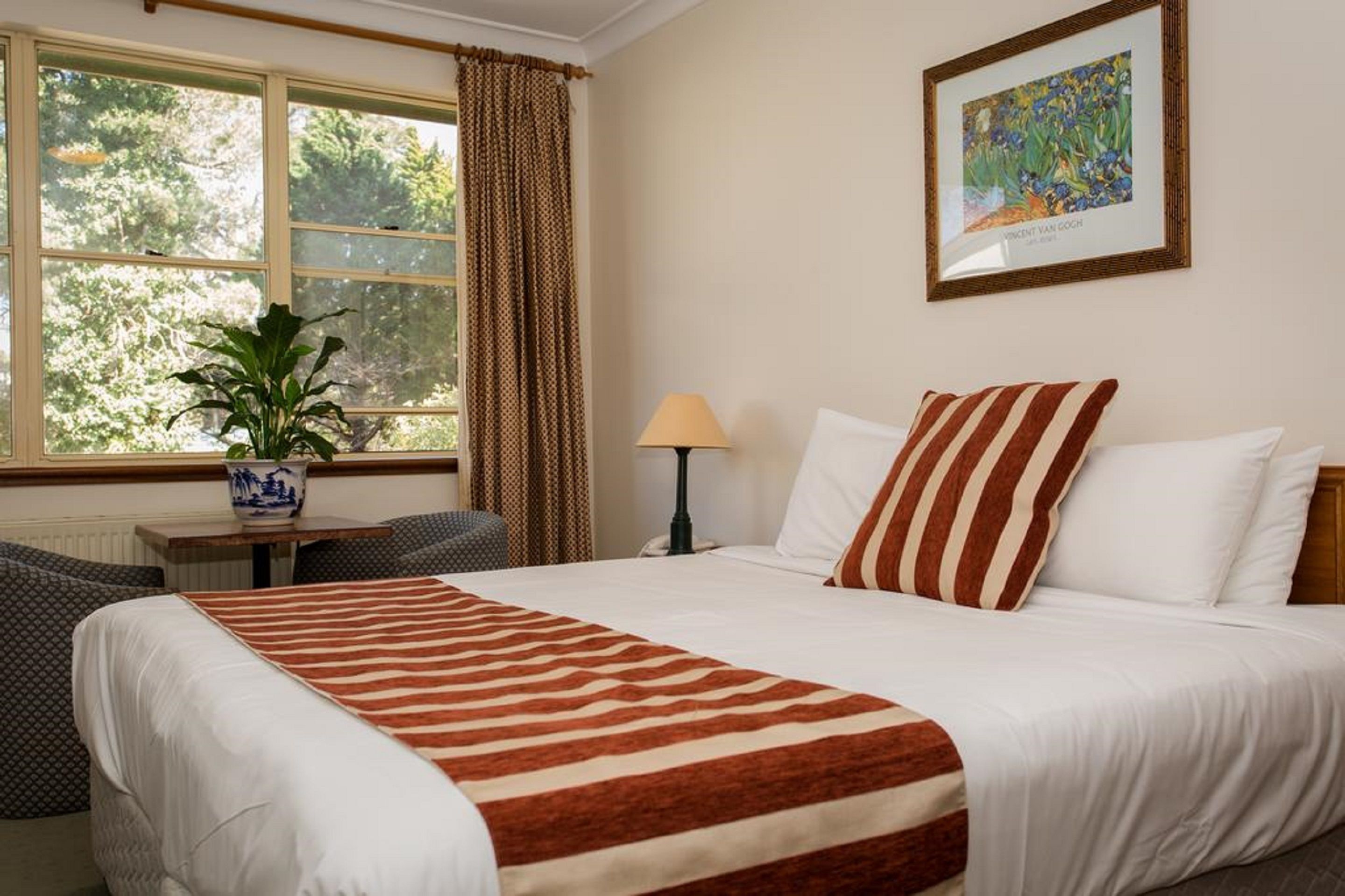 Standard Double Room | Minibar, individually decorated, blackout drapes, iron/ironing board