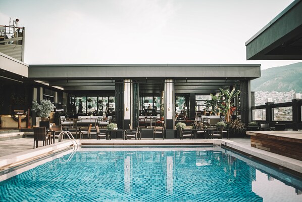 4 indoor pools, seasonal outdoor pool, pool umbrellas, pool loungers