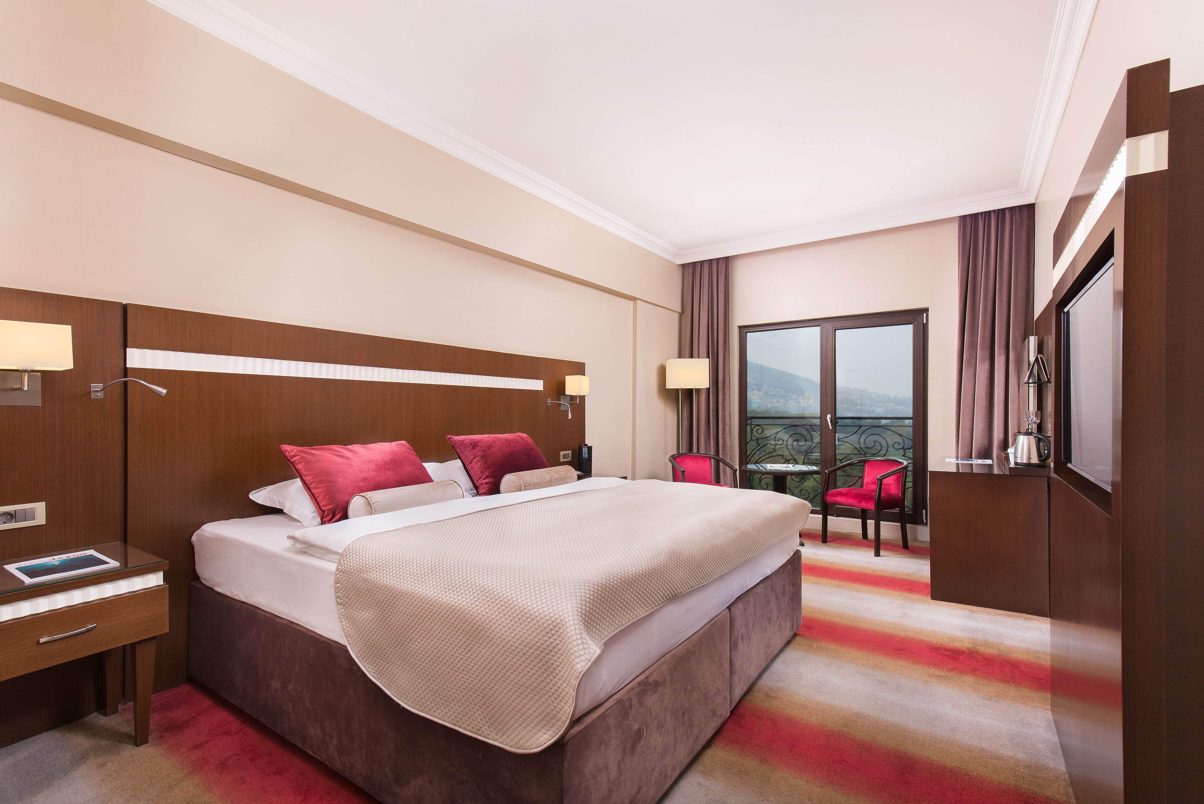 Premium bedding, down comforters, free minibar items, in-room safe