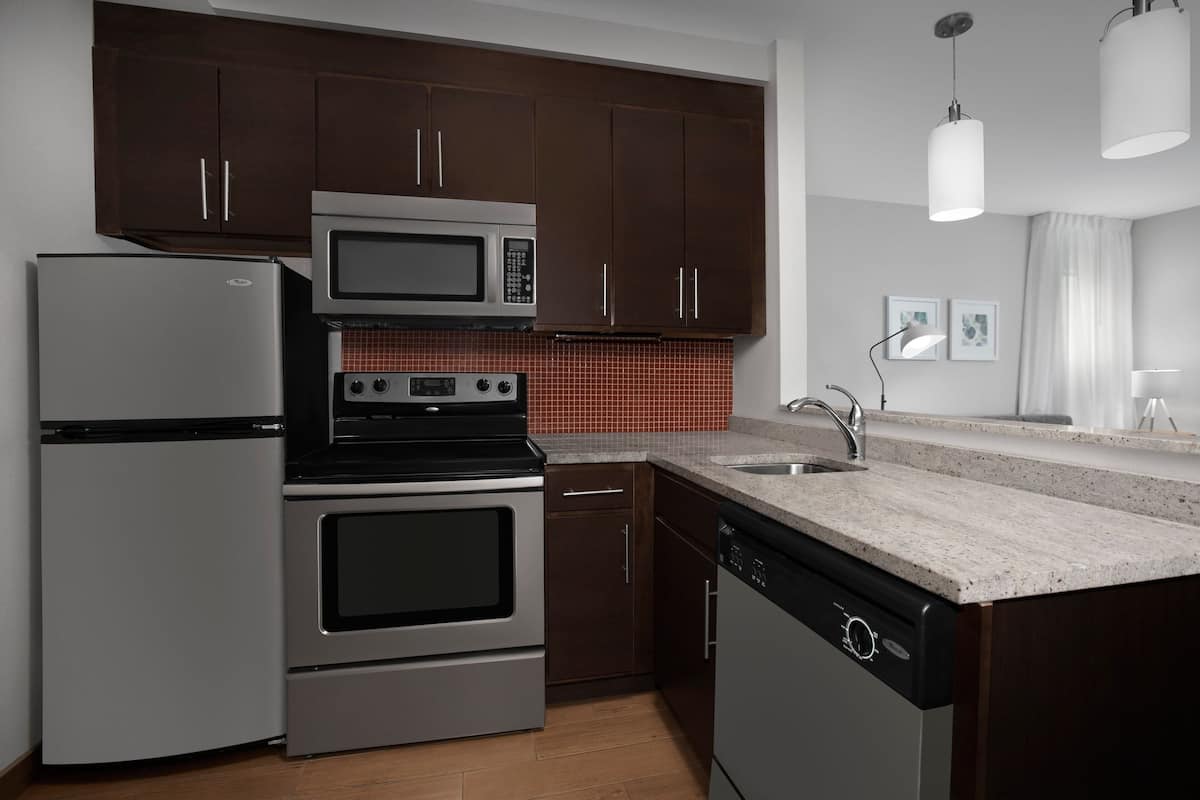 full-sized fridge, microwave, stovetop, dishwasher