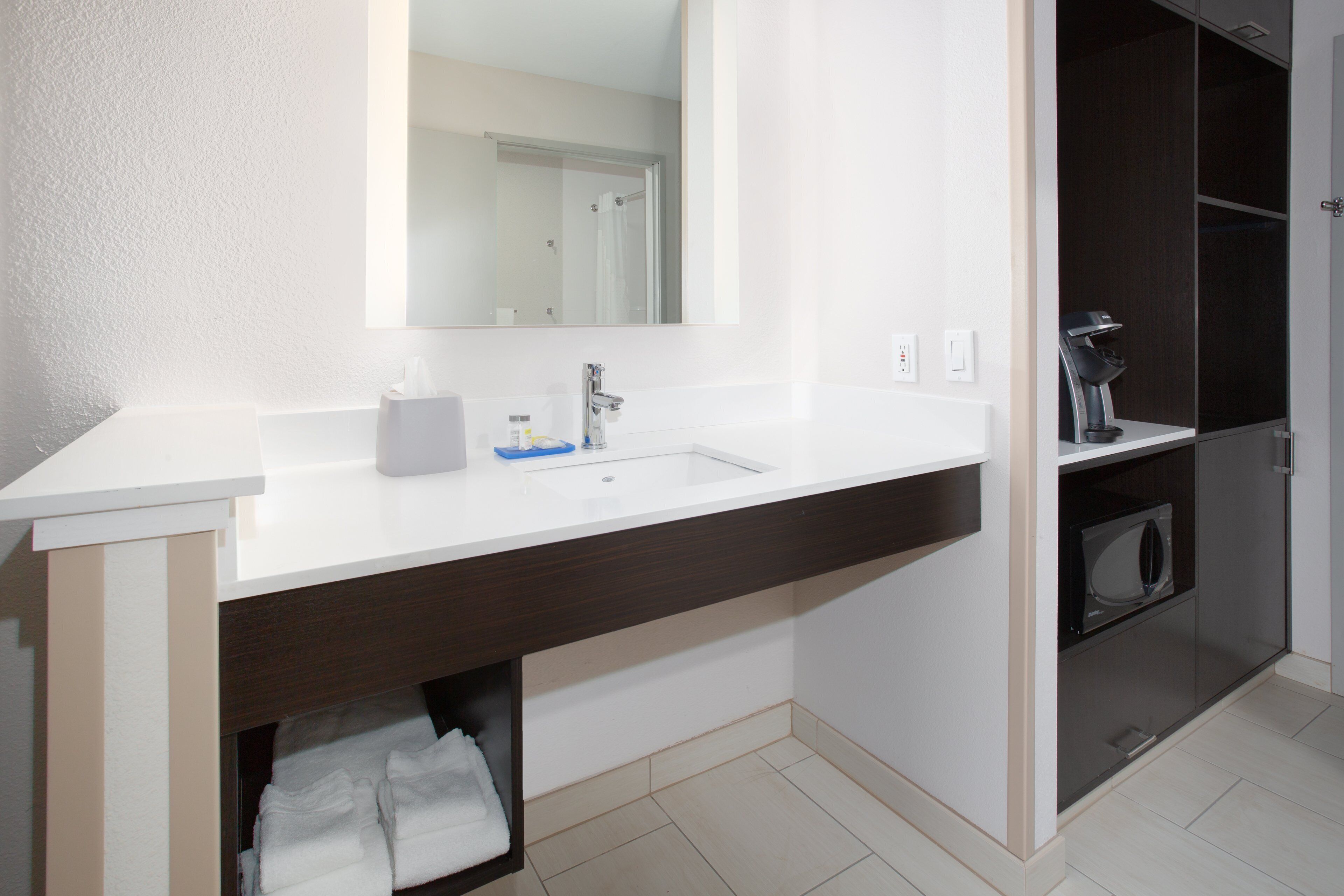 Designer toiletries, hair dryer, towels, soap