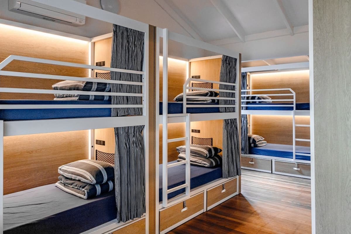 Bed in 8-Bed Mixed Dormitory Room | Blackout drapes, bed sheets