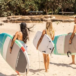 Beach nearby, beach umbrellas, beach towels, surfing