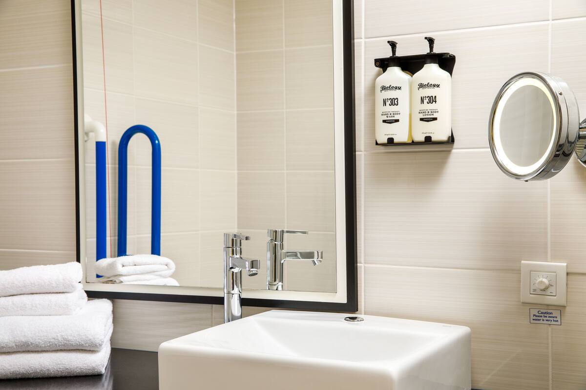 premium room, 1 king bed, accessible | bathroom | shower, rainfall showerhead, free toiletries, hair dryer