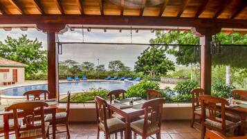 Breakfast, lunch served; local and international cuisine, pool views