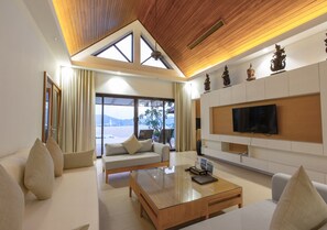 Grand Suite, 4 Bedrooms | Living area | 32-inch LCD TV with cable channels - IndoChine Resort & Villas (Patong)