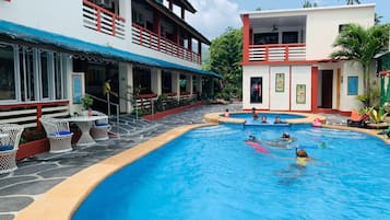 Relax by the pool surrounded by comfortable seating and a serene atmosphere.