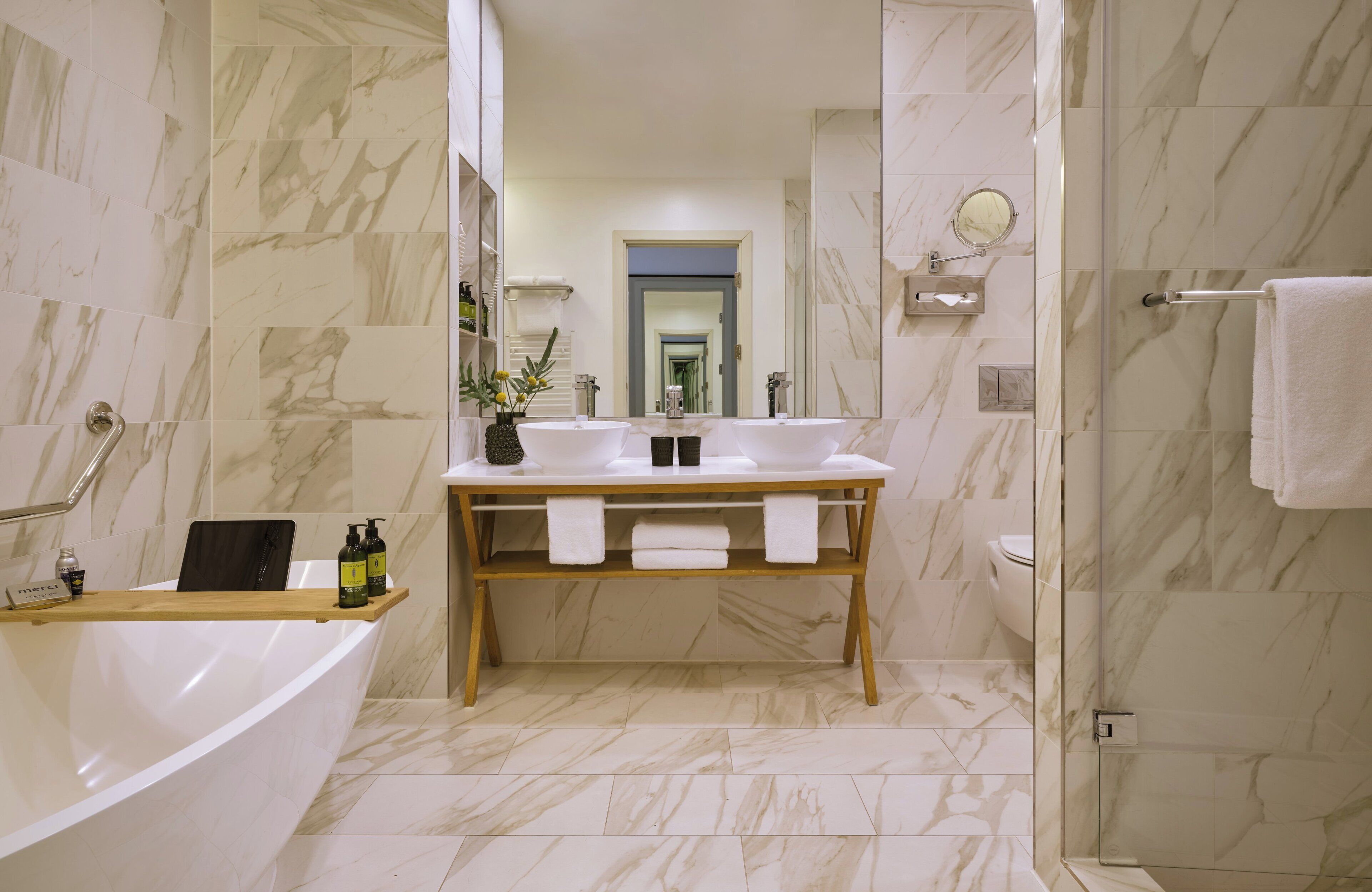 executive suite | bathroom | hair dryer, towels, soap, shampoo