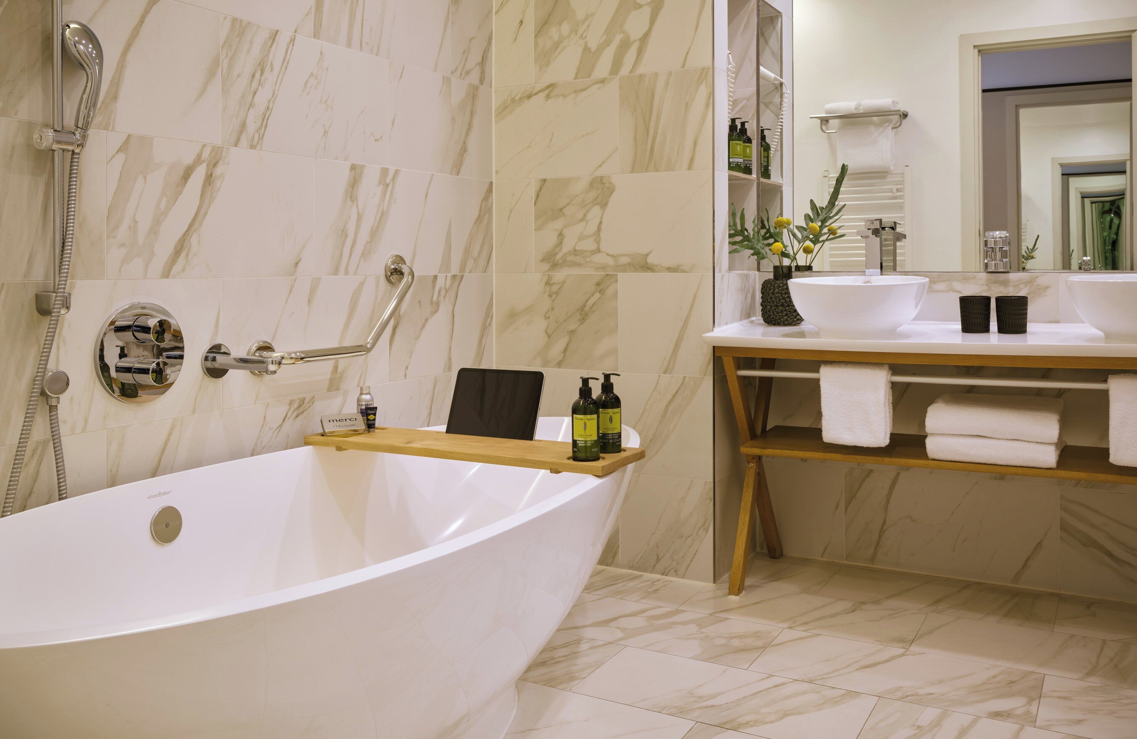 executive suite | bathroom | hair dryer, towels, soap, shampoo