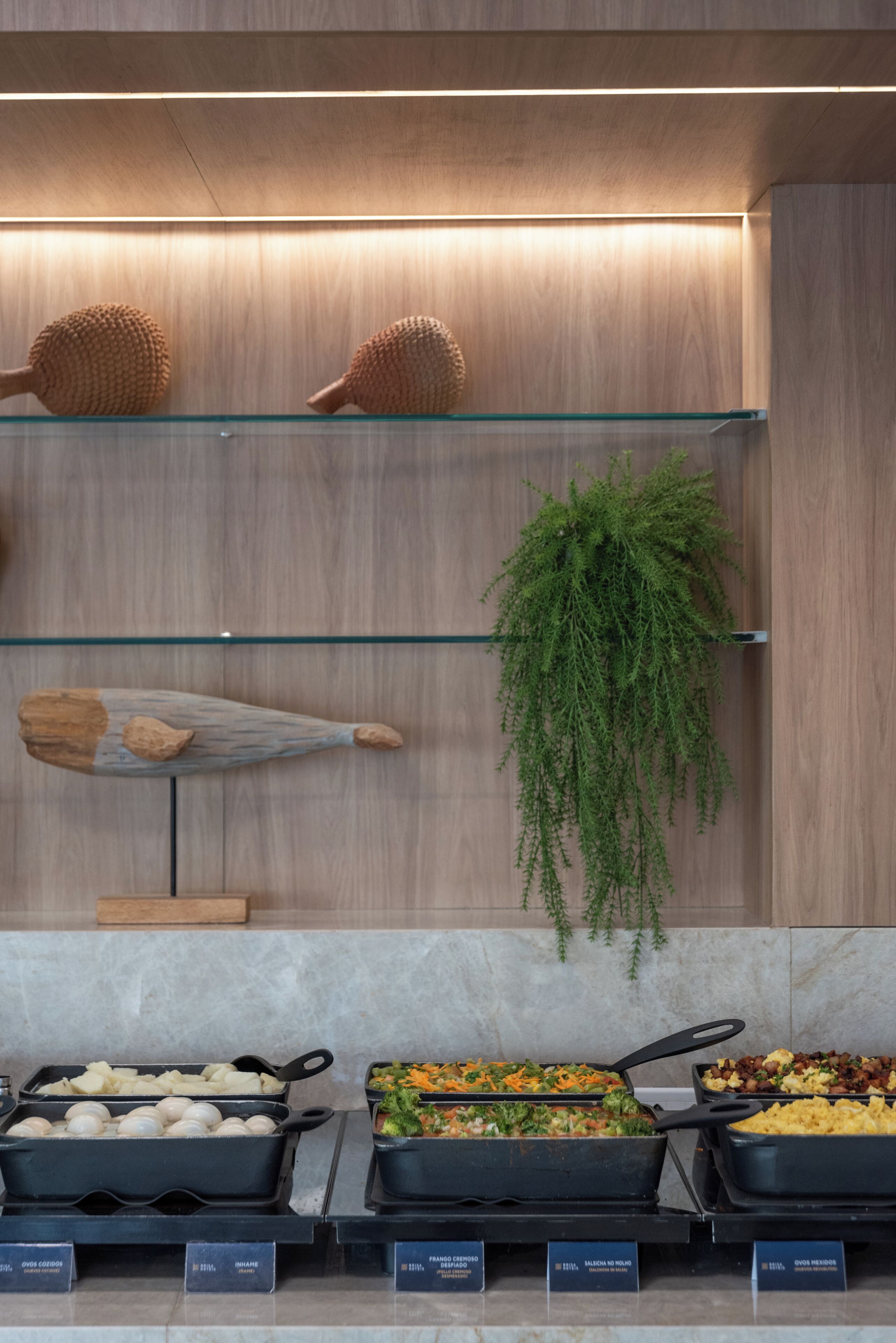 A buffet area with various food options and decorative items.