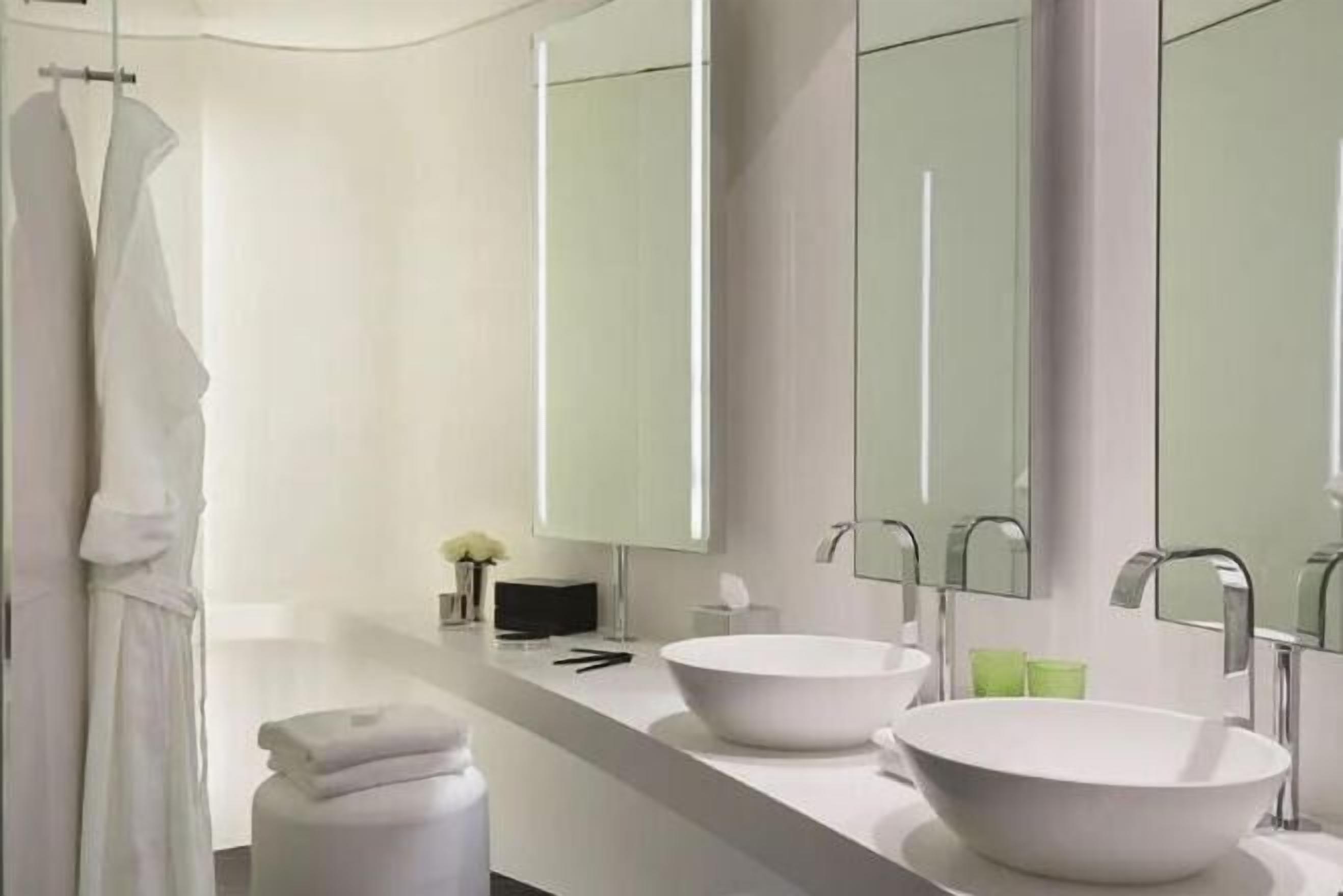 Designer toiletries, hair dryer, bathrobes, slippers