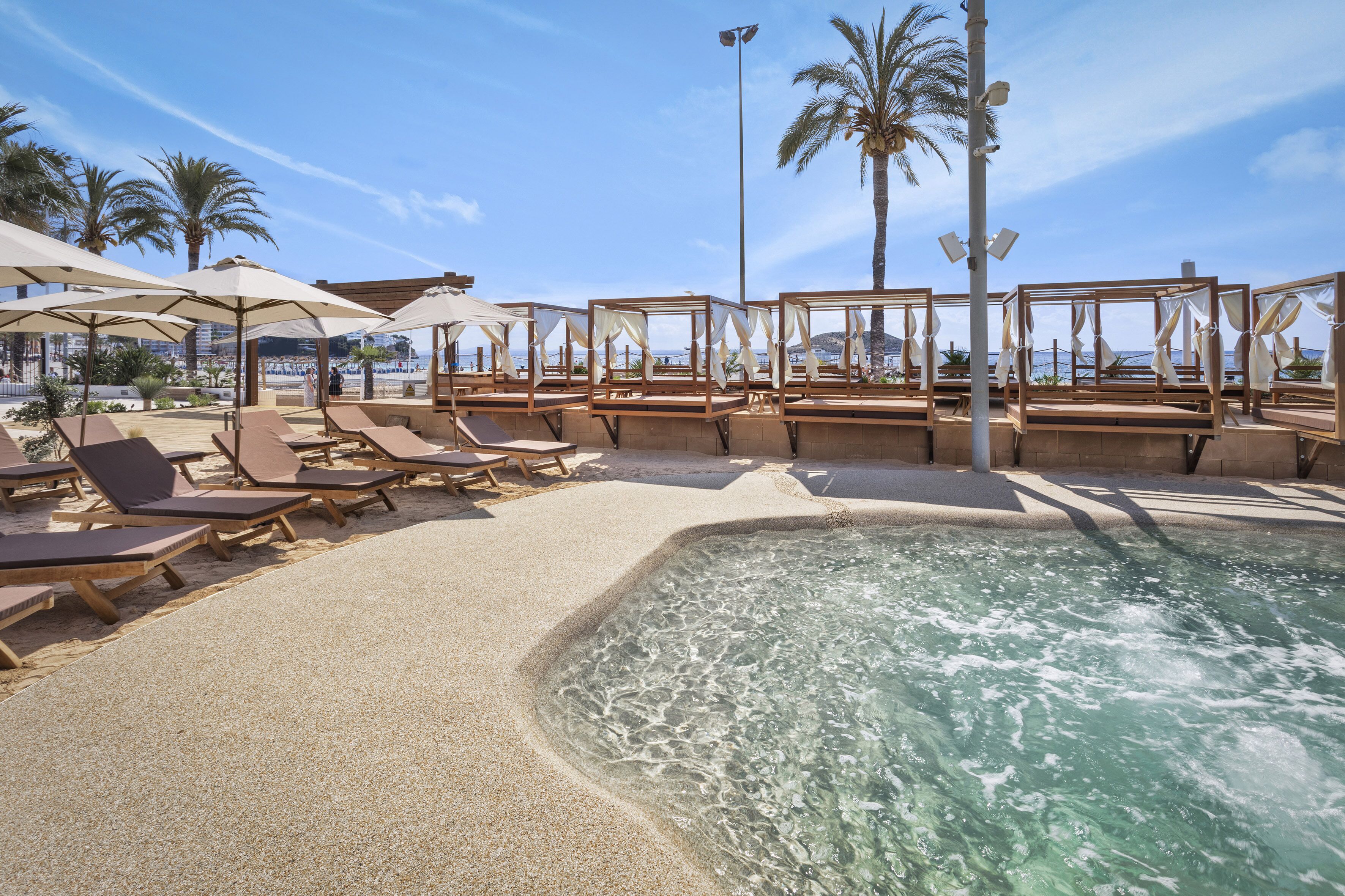 outdoor pool, pool umbrellas, pool loungers