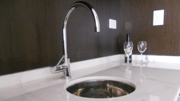 A modern bathroom with a stainless steel sink, a chrome faucet, and a marble countertop. - Kenton Palace Buenos Aires (Buenos Aires)