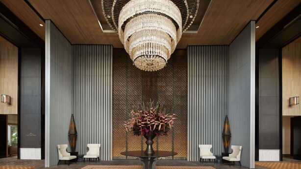 A lobby with a large chandelier, a central table with a floral arrangement, and two white armchairs. - Keraton at The Plaza, The Unbound Collection by Hyatt (Jakarta)