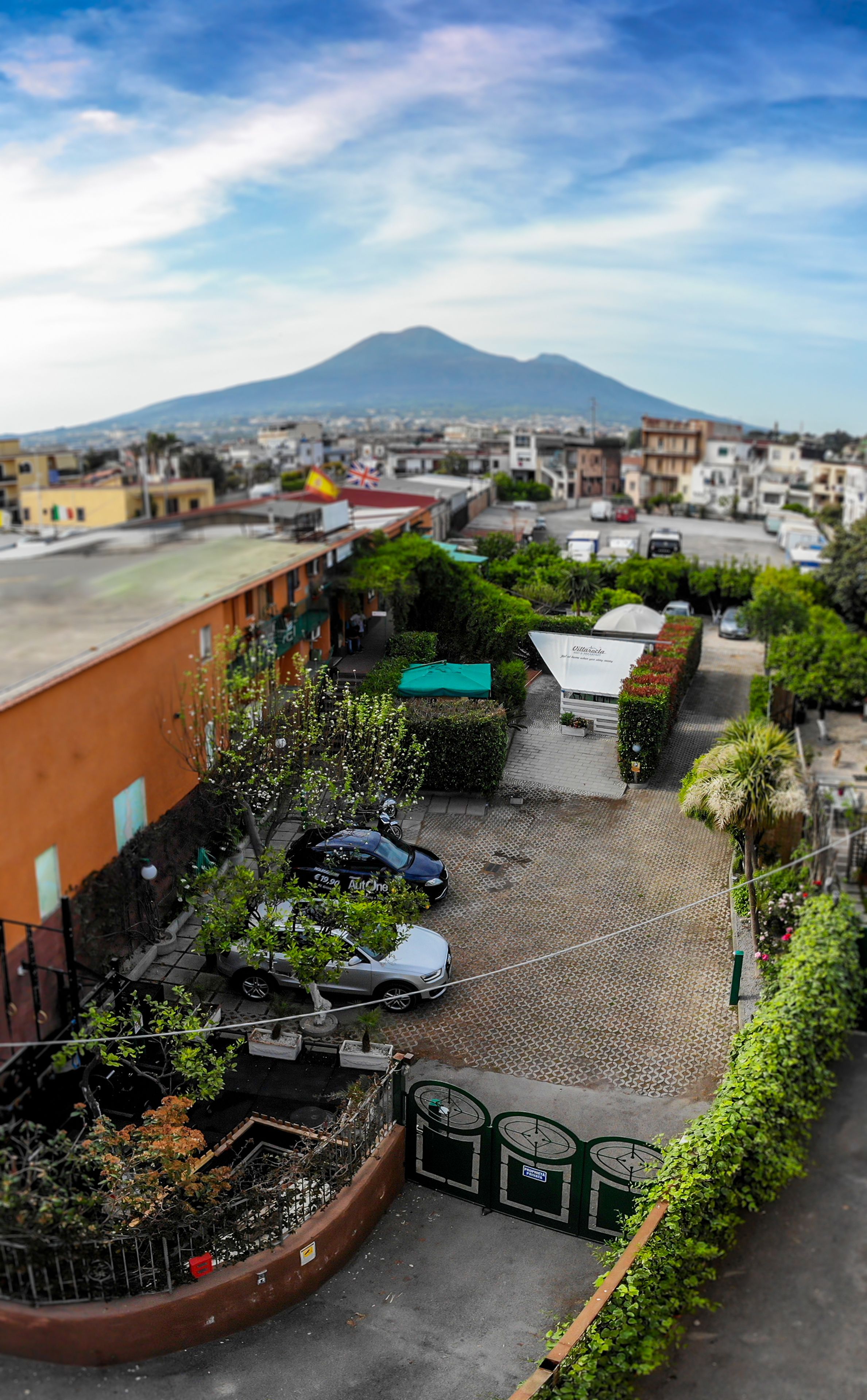 A parking area with a view of a mountain in the background.
