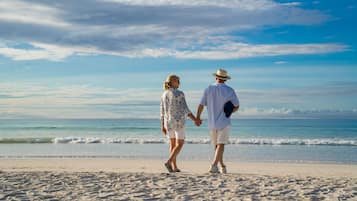 Beach nearby, white sand, beach towels