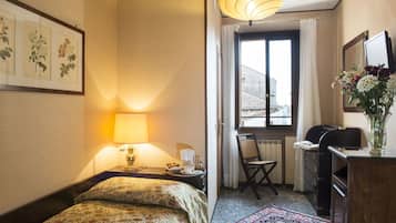 Habitació individual estàndard | Cobrellits, minibar amb articles gratuïts i caixa forta a l'habitació