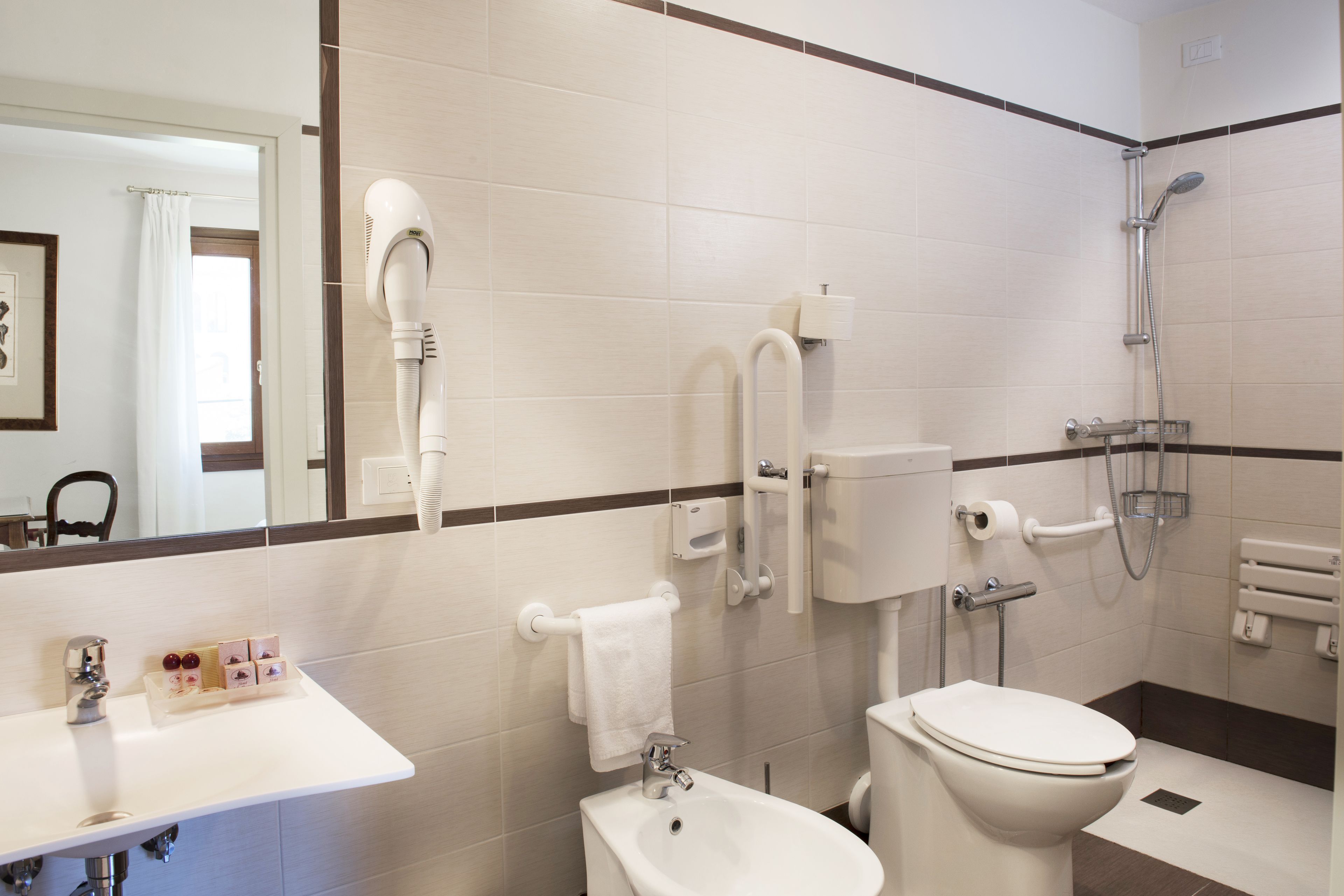 free toiletries, hair dryer, slippers, bidet