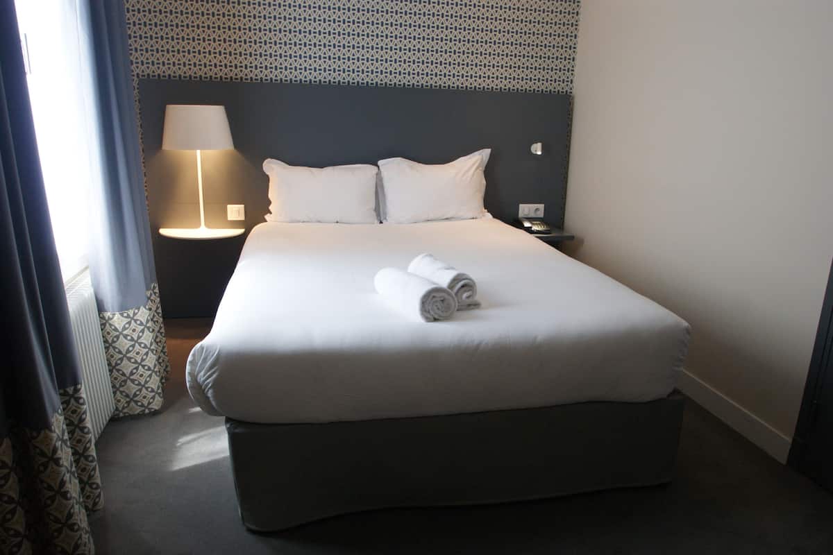 premium bedding, desk, laptop workspace, blackout curtains