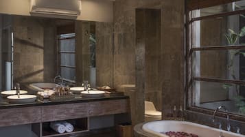 Combined shower/bathtub, hair dryer, bathrobes, slippers